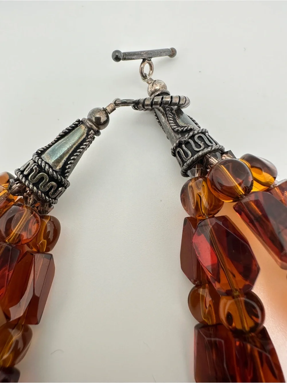 Multi-Strand Amber Glass Necklace with Turquoise Heart Pendant